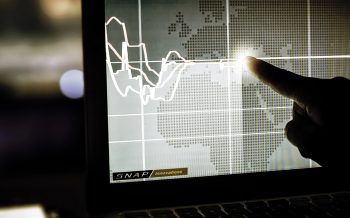 Day trader computer screens with charts, Vienna Austria, 25-3-2018